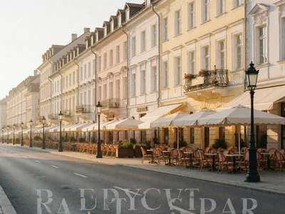 Pastel European boulevard lined with cafe awnings in soft morning light